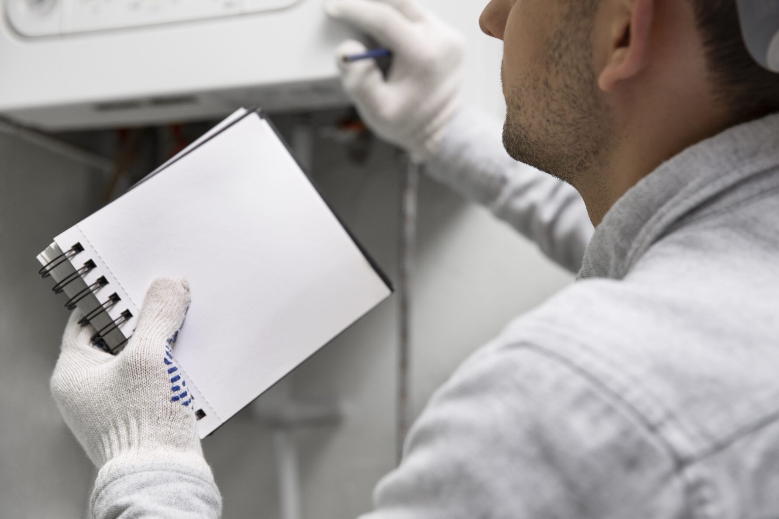 worker-repairing-water-heater-2-min